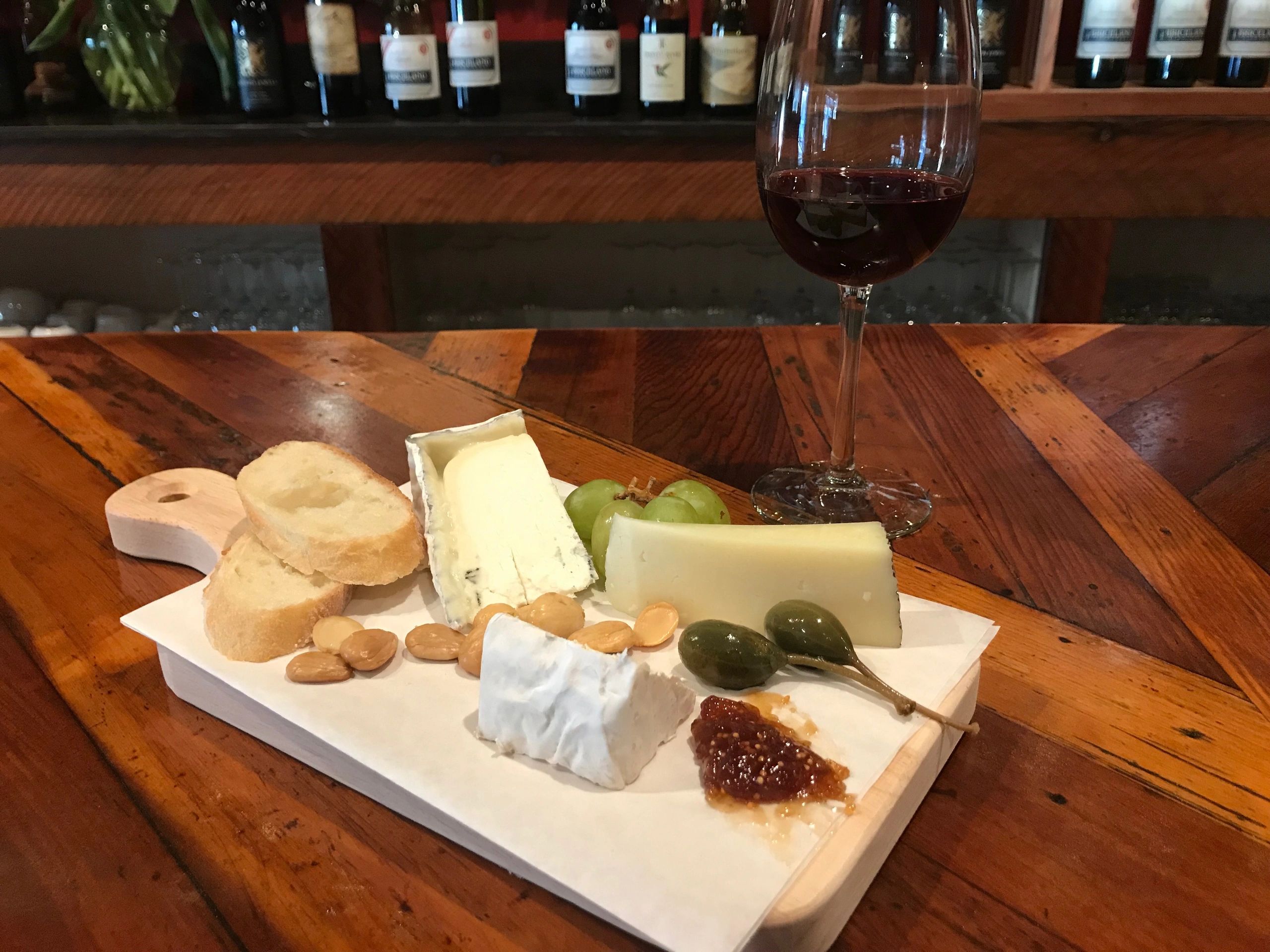 Charcuterie and cheese board with wine